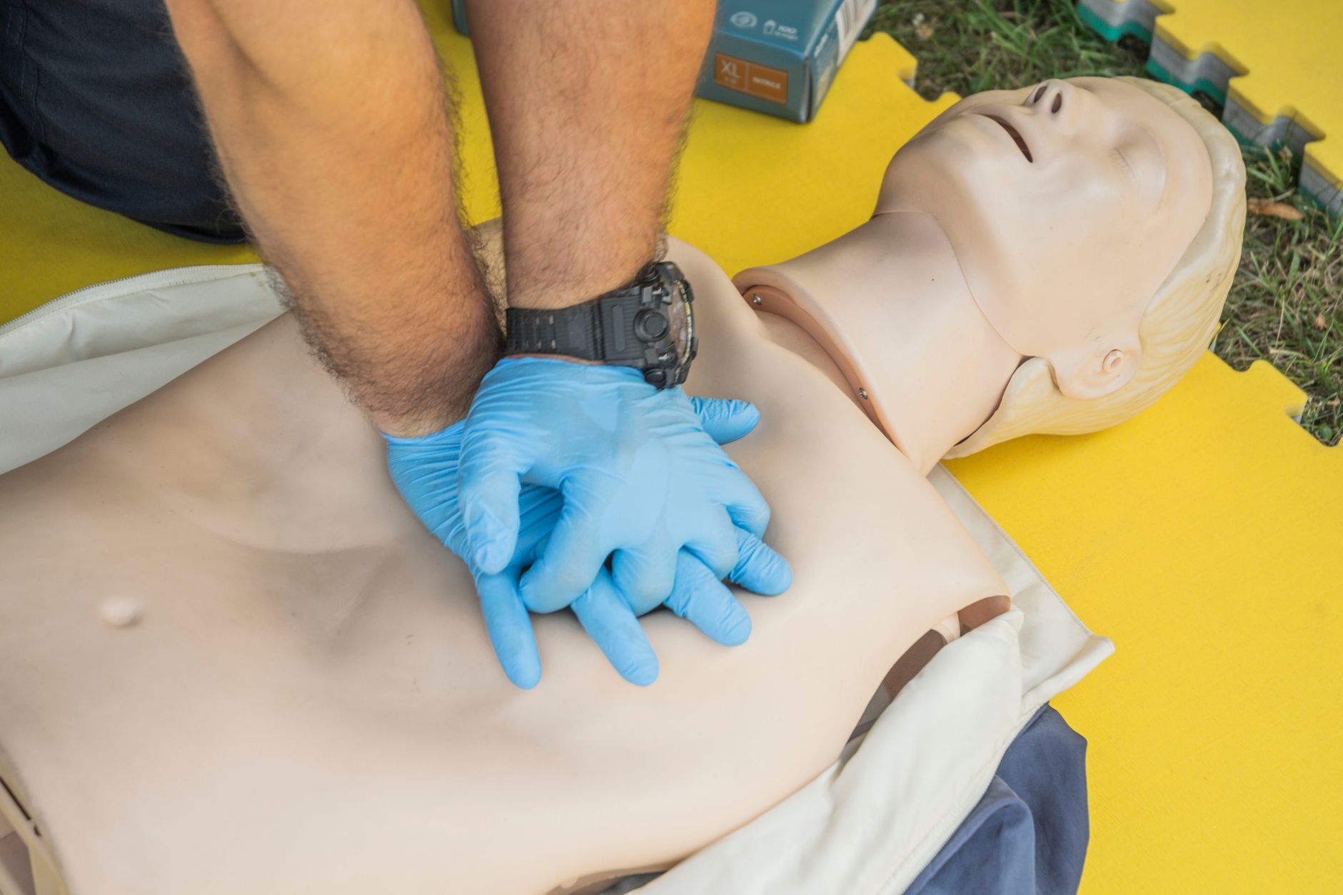 Demonstrating chest compressions at a BLS hands-on skills check