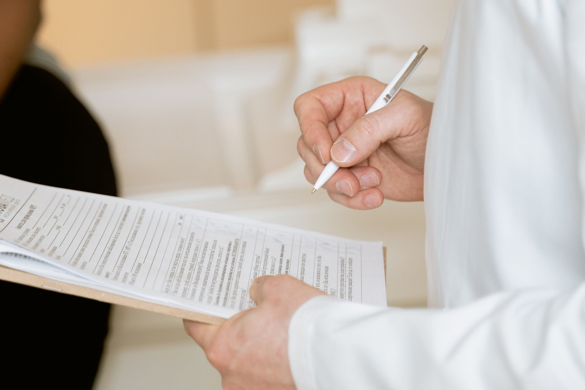 Nurse interpreting a patient’s lab results and vital signs on the chart