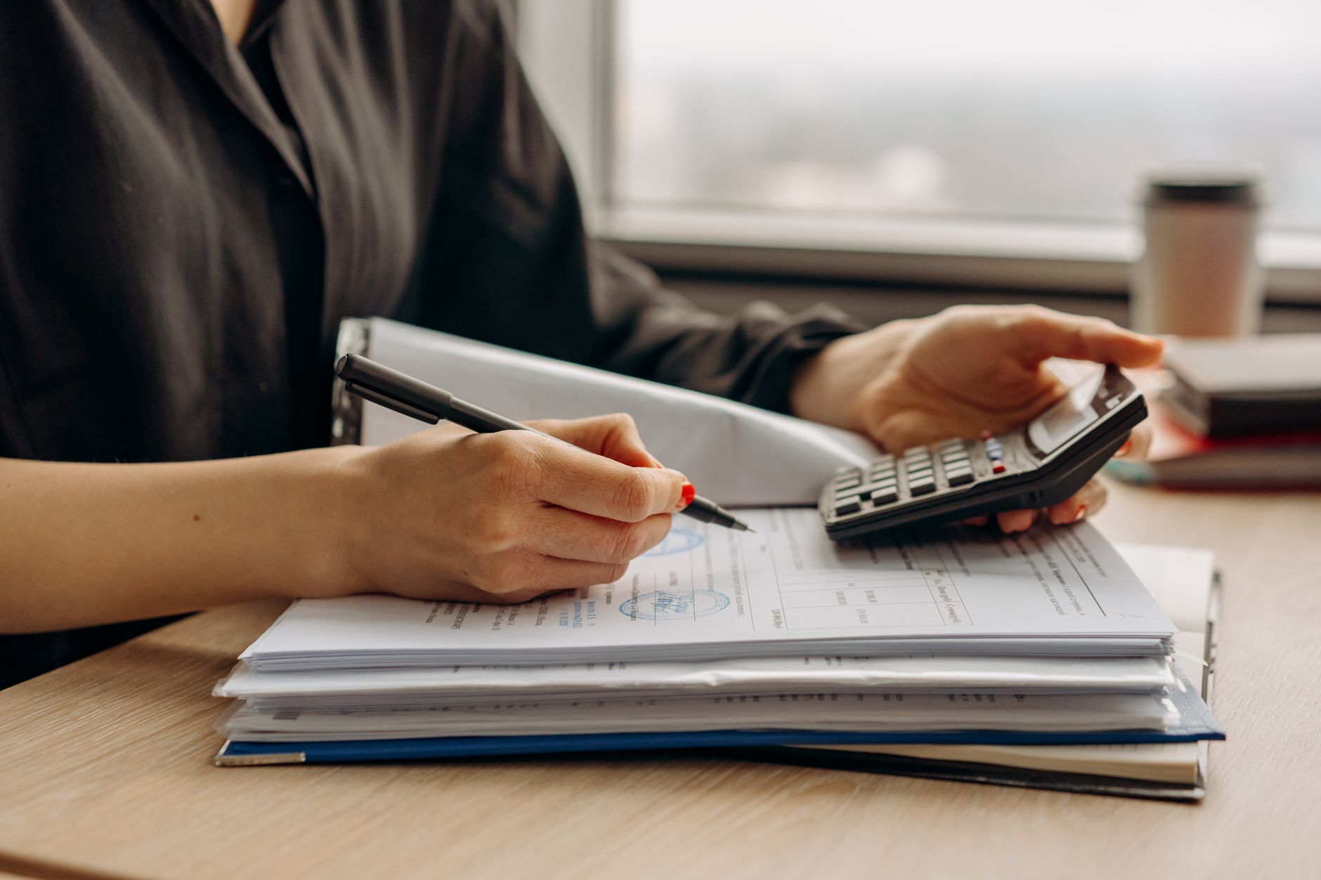 Nurse reviewing pay and cost-of-living figures before negotiating an offer