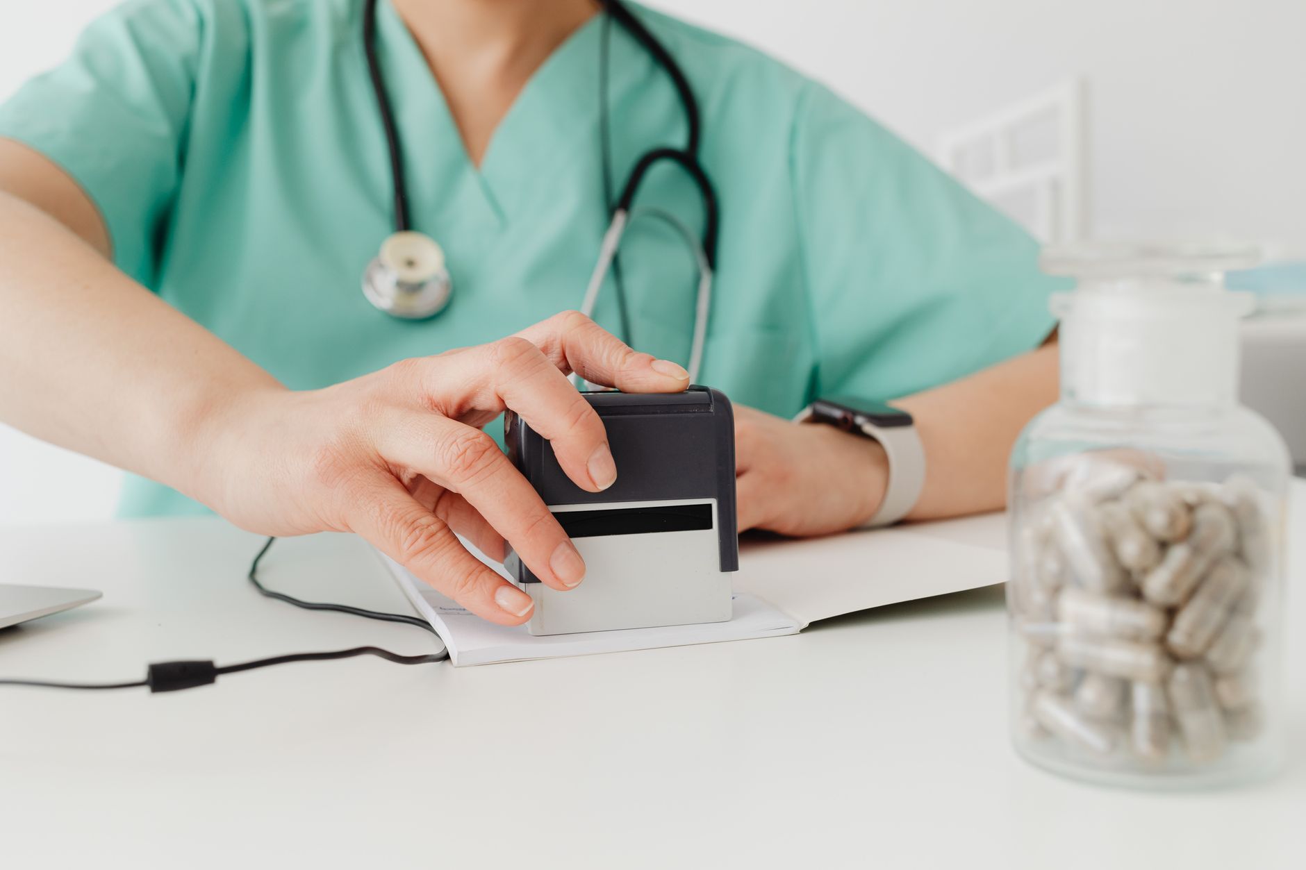 Nursing student studying NCLEX pharmacology by drug class and nursing action