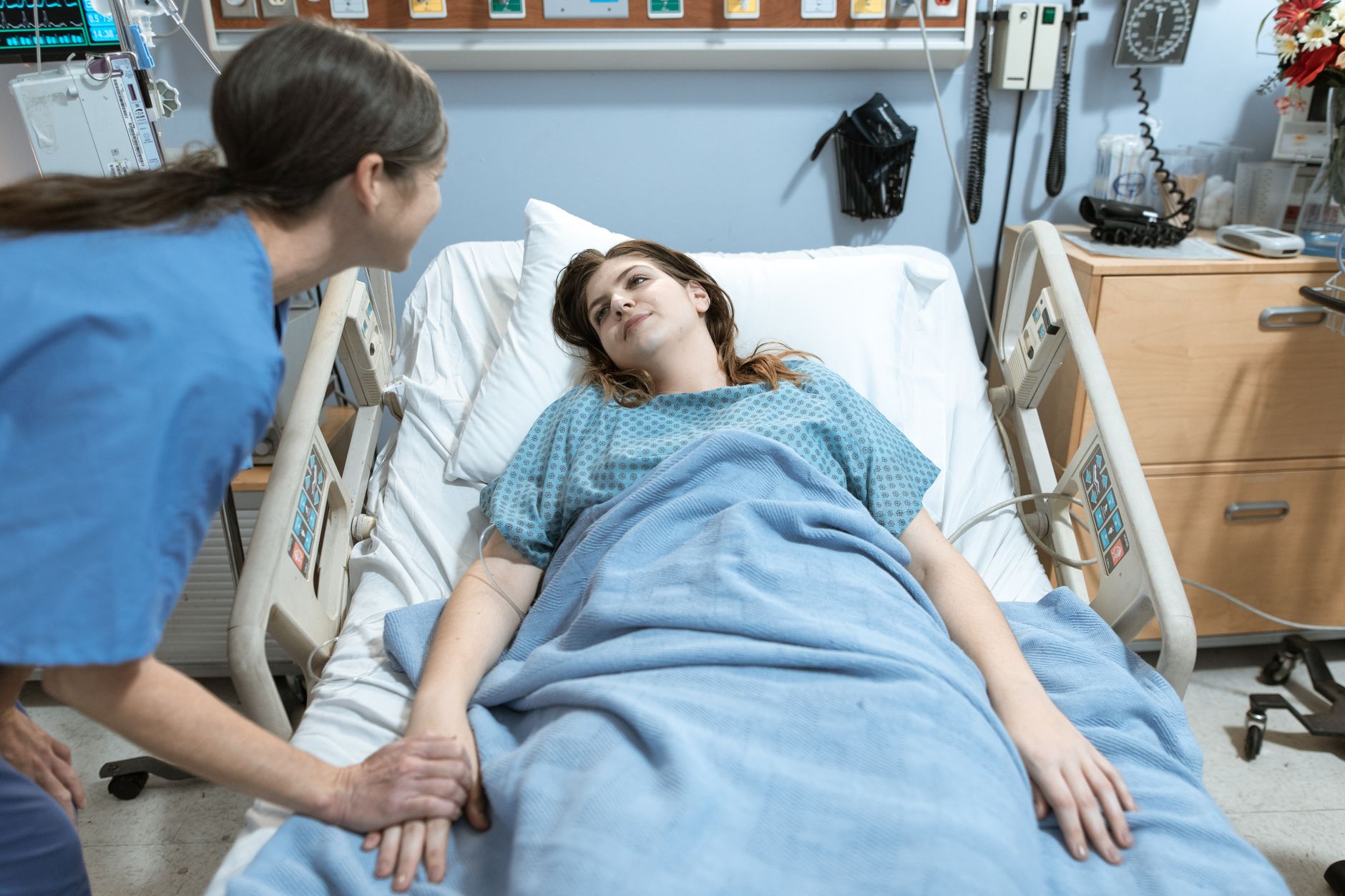 Nurse making a clinical-judgment decision at a patient bedside