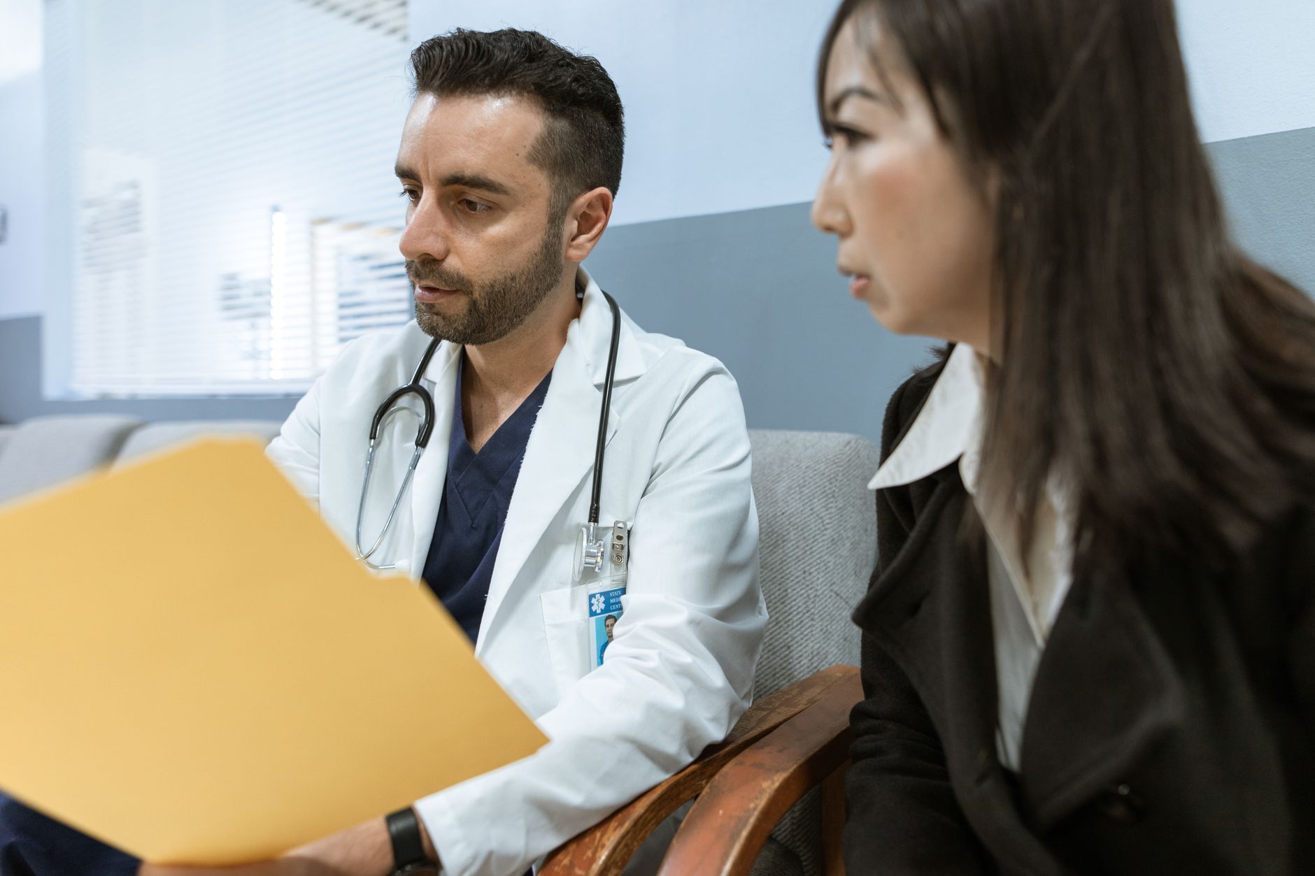 Nurse practitioner counseling a patient on lifestyle and long-term care