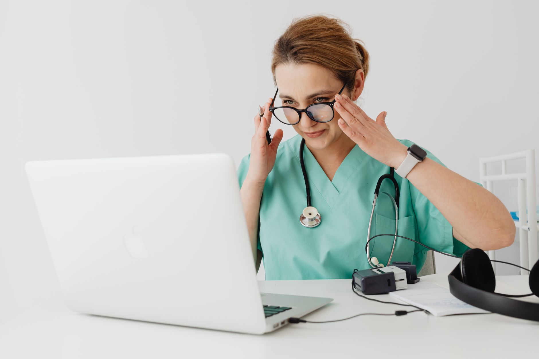 Registered nurse studying for a graduate NP degree to raise earning potential