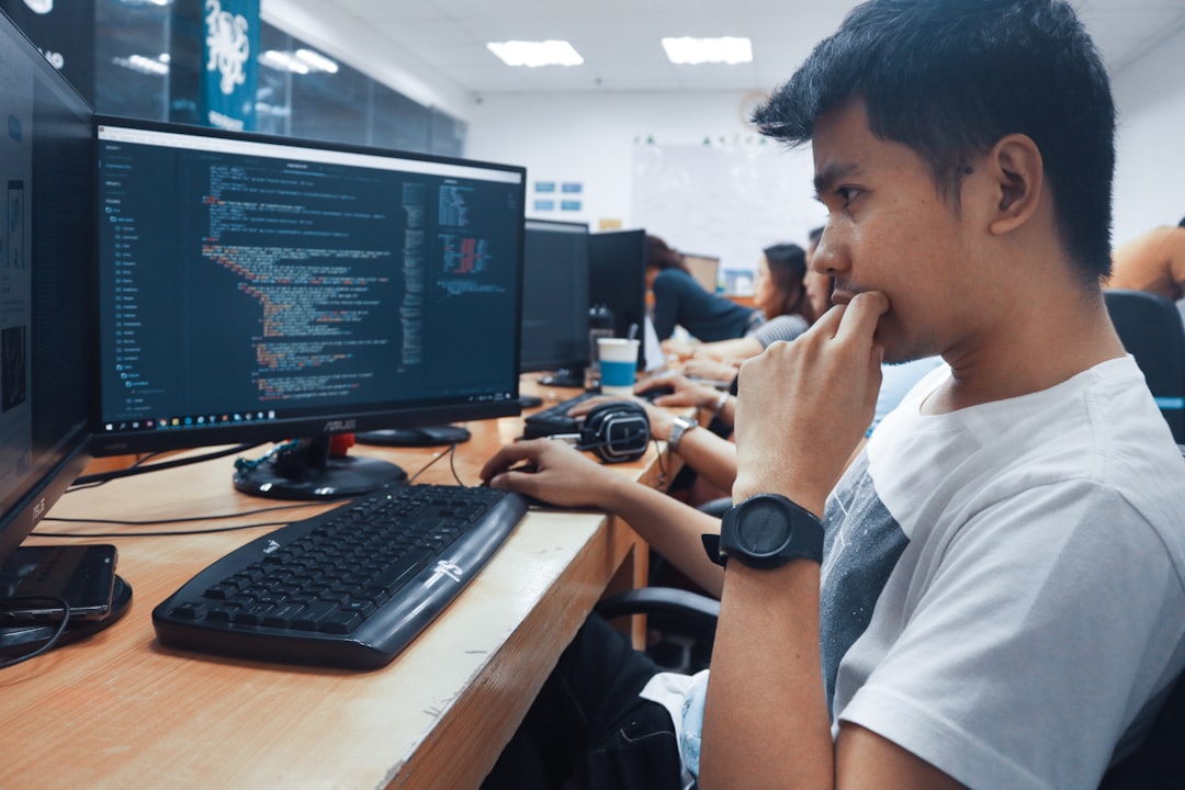 Nursing student taking the ATI TEAS exam on a computer at a proctored testing center