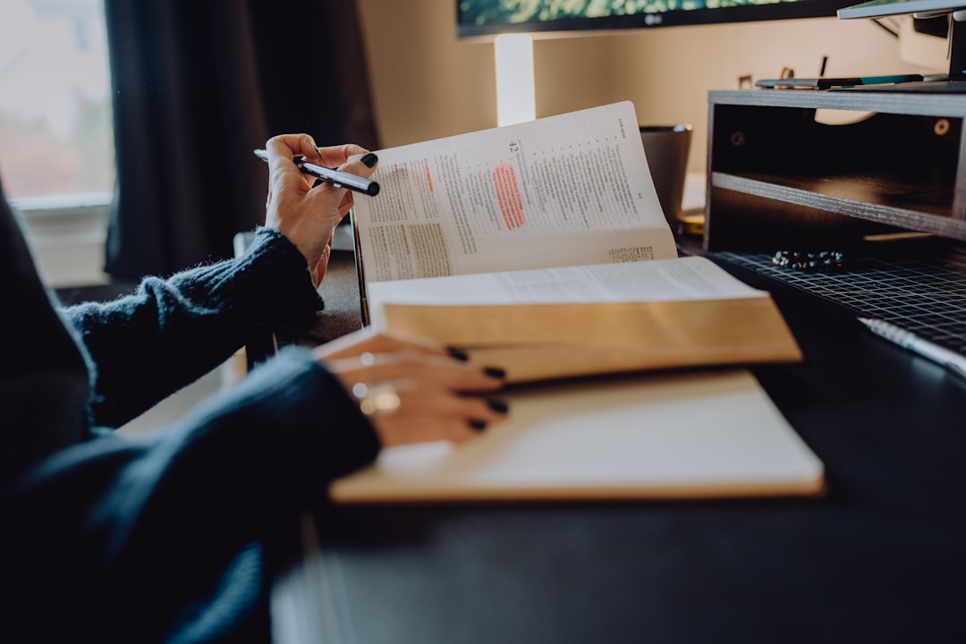 A pre-nursing student annotating a reading passage with a pencil while a timer runs nearby
