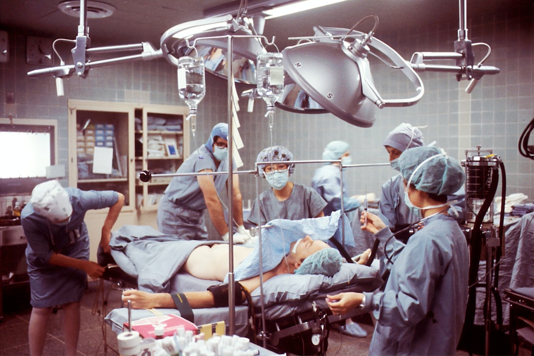 Emergency nurses performing a systematic trauma assessment on a patient