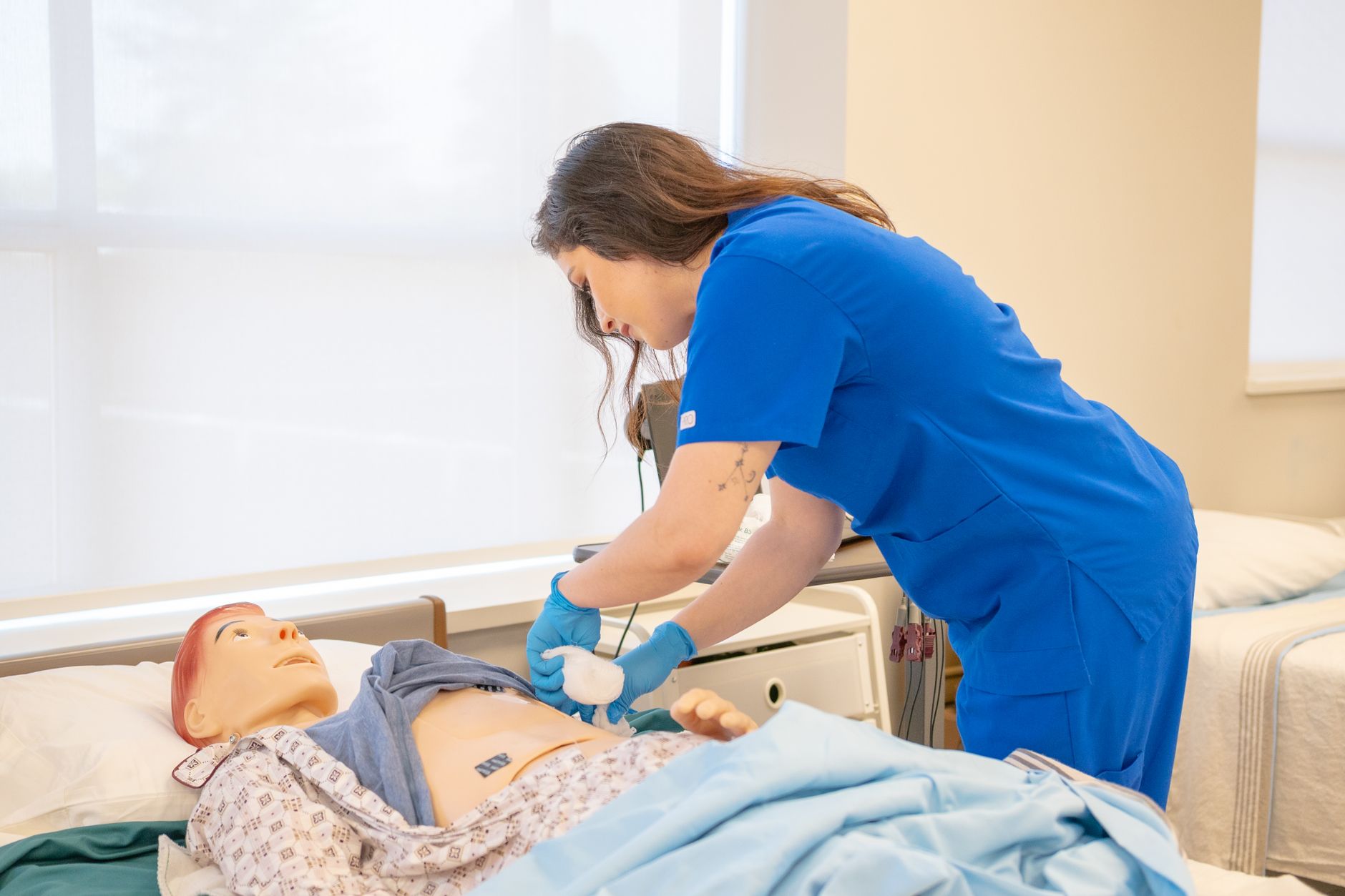 Nursing students in a Chicago hospital simulation lab practicing patient care during a clinical rotation