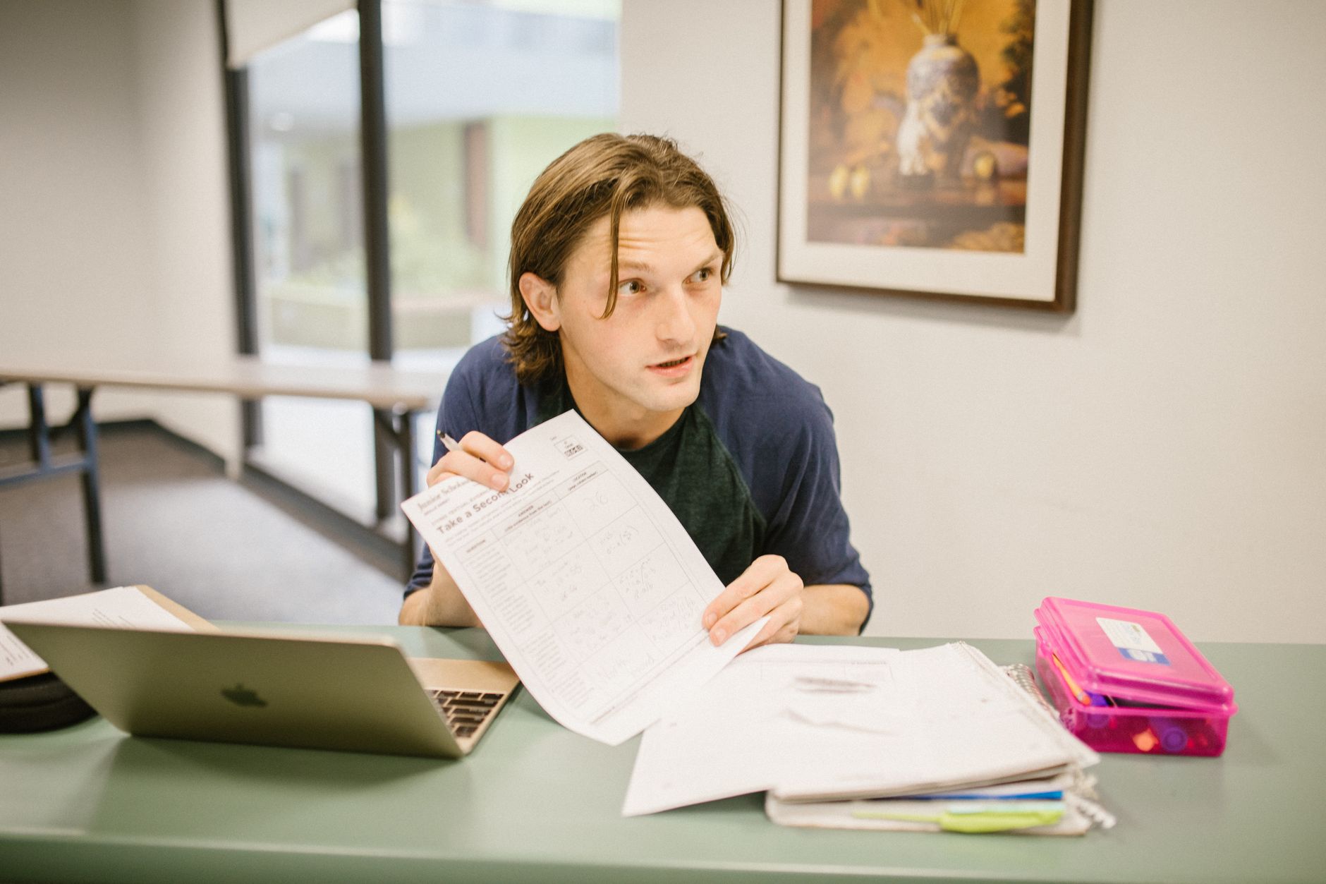 Nursing student working through NCLEX practice questions and rationales on a laptop