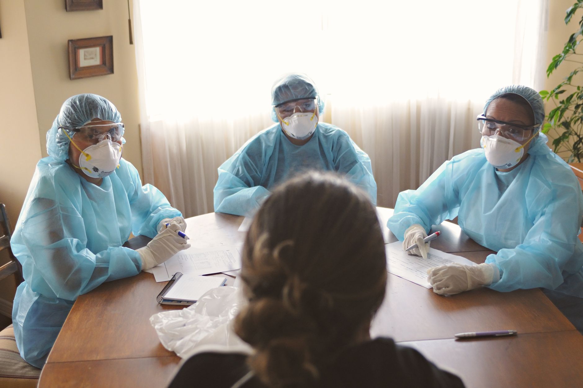 DNP-prepared nurse leader in a hospital leadership meeting
